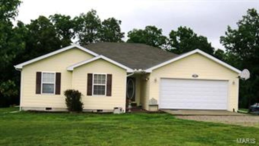 QUALITY BUITLT HOME WITH MANY UPDATES!!!! This home is located on a cul de sac, with 3.98 acres of land, with some gorgeous trees. This home features 4 bedrooms, 2  baths, formal Dining, living room, spacious kitchen, laundry room and a nice size deck. The spacious kitchen is the heart of this home with it's many cabinets, breakfast bar, and newer appliances. The living room/ kitchen has an open floor plan that flow together very well, with pretty light colored wood flooring. As you walk out the back door of this beautiful home the view is breathtaking. The large home backs up to a wooded area with many trees. This home is sure to impress!