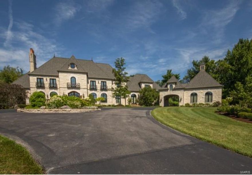 This home is just exquisite in everyway.  Greeted with a private gate at the base of the driveway, one will know that they have arrived at something very special.  Four sided stone, 1.5 story totaling over 11,000 sq. ft. with large finished walk out lower level. The lot is amazing totally 3.5 lush acres, beautiful inground pool with privacy glamour and a large covered rear patio.  4 car garage, large front Circle makes for a very impressive curb appeal.  There are a total of 5 bedrooms, 6 full, 3 half baths.  Beautifully flooring, custom millwork and cabinets, quality lighting and finishes throughout.  Elevator serves all three floors.