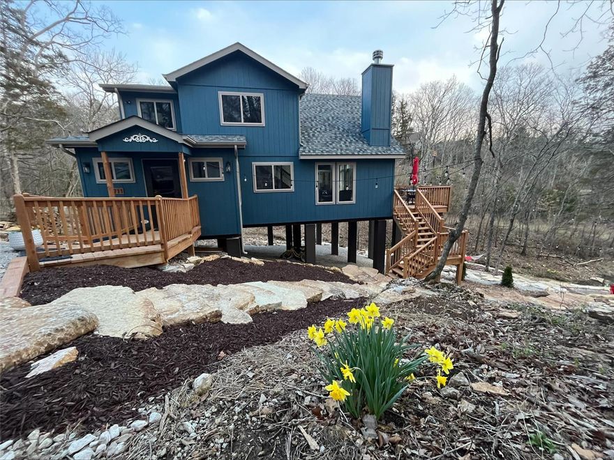 BRAND NEW chalet and furniture - make your summer dreams come true in this AMAZING chalet on Lake Frieden! This long lake has a big lake feel and is perfect for Paddleboarding and Kayaking and fishing! Hop on the trailhead steps outside the front door or make a big meal in the expanded tiled kitchen with island. This chalet lot has so much character, you need to see it to appreciate the extensive landscaping and limestone steps added to create a cozy atmosphere and bring you closer to nature. Inside the front door are cubbies for all your gear and a window seat custom made to take in the lake view with a book in hand. Screened porch offers views and the sounds of the wet weather creek and allows you to hunt for some pretty amazing fossils! Lots of upgrades and attention to detail in this property! Whether this is a family getaway, or you are using as an investment property rental, this chalet is ready for you this summer!