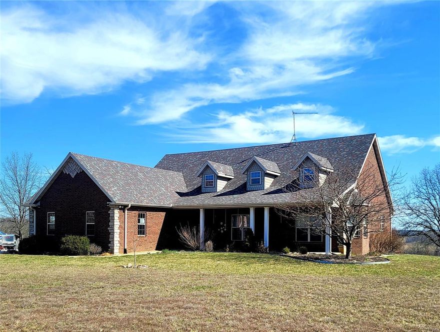 Stunning contemporary 4-Br, 3.5 Ba, brick/stone home with miles of incredible views out the sun-room windows/overlooking pond and 170.98 acres m/l, mixture of pasture and mature timber, walnut, oak. covered front porch leads to foyer which opens into great-room that features gas log fireplace, hickory floors, trey ceilings, crown moulding, kitchen with custom hickory cabinets, island/bar, all appliances, dining area, main floor laundry, master suite with door to deck, master en-suite bath, double sinks, jetted tub, two walk-in closets, 2 other bedrooms up and one in basement that does not have window., mudroom, full finished basement, could be in-laws suite, full kitchen, bath, storage, large family room with wood burning fireplace, deck, two car oversized garage, whole house generator, 2 ponds, 1 stocked, 40 x 48 shop/RV, 14' and 16' doors w/ electric and water, older barn, paved frontage, owner reports wildlife, fenced on 2.5 sides, all located close to Piney River access.