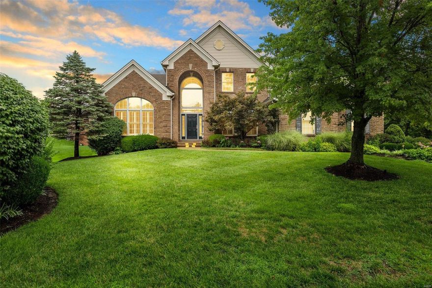 Stunning Town & Country estate home offers custom upgrades throughout.  Step into the grand entry foyer with marble & curved staircase flanked by box beamed office and a large dining room complete with butler's pantry and extensive custom millwork that welcomes you to the luxury that awaits.  The kitchen has 42" custom cherry cabinetry, granite countertops, center island, and breakfast bar.  The breakfast room invites you to walk out on to the composite deck and take in the beauty of the premium cul de sac lot, or you can settle into the warmth of your hearth room complete with stone fireplace and vaulted ceiling.  The main floor master suite has his and her walk in closets, and a large bathroom complete with whirlpool tub, two vanities, and separate shower.  Upstairs are three MASSIVE bedrooms, one with private bath and two with a Jack & Jill bath.  Lower level has two full baths, bar, built in entertainment center, and much more. Many new upgrades! House appraised at $1.32 million!