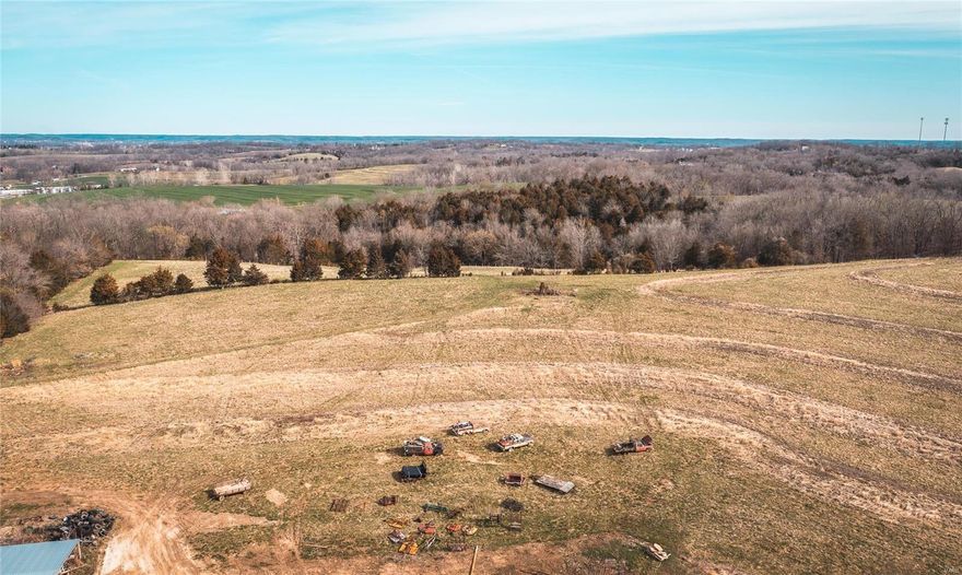 80 Acres M/L outside City Limits of Washington, and minutes to town. Multiple Tax ID's to this property. This property offers a great secluded entrance property that has some spectacular views. Multiple building spots for those that want to build that dream home and possibly renovate the 1800's built Farm Home. It has a 1900 built barn that was still in use for cattle up until the fall of 2021. Has a BIG shop that can accommodate the bigger equipment or vehicles to work on or store. Hay Barn Equipment Shed are very well built and store lots of things to keep from the weather. 40 acres M/L of Pasture for your grazing animals or hay to cut for the winter. This could be your hidden gem in Franklin County for the family farm retreat. Property is also already surveyed into 8-10 acre parcels with the county called Owls Nest Subdivision if someone wanted to develop the property into 8 large acreage properties.