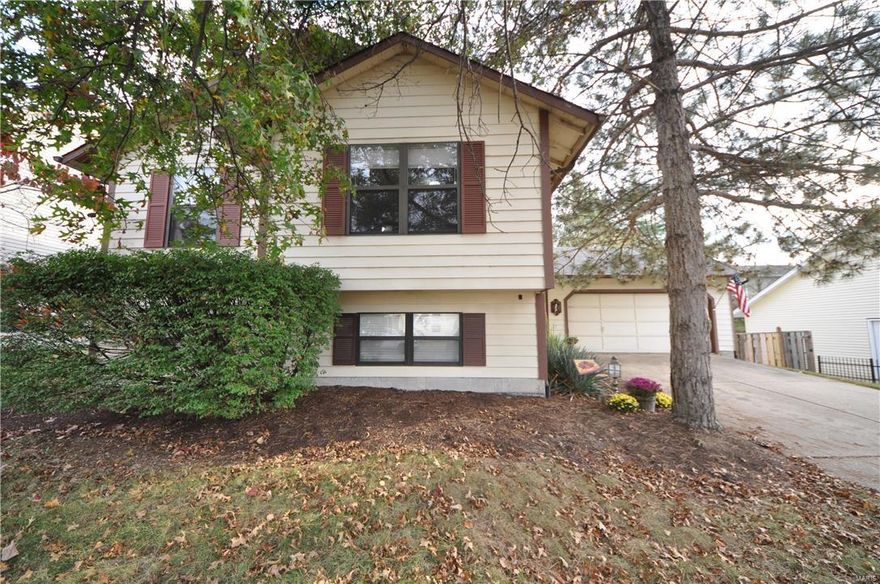 OPEN HOUSE 1/22! Beautifully updated 4BR 2BTH home w/1800+ SF of living space & fenced in yard in quiet Meadowridge sub. Exterior feat new roof (2015), new A/C (2014), covered porch, 2 car garage & patio looking out to fenced in backyard. Interior w/entry foyer w/ceramic tile leading upstairs to open floor plan. Spacious living rm w/vaulted ceilings, built in TV nook & wall to wall windows providing tons of natural light. Breakfast rm & kitchen w/new hand scraped laminate flooring (2016) & atrium door out to stairs to patio. Kitchen also includes pantry & SS dishwasher & microwave. Upper level also feat full bath w/dbl sink vanity w/jack n jill door to spacious master BR. 2 add'l BR on upper level. Partially finished walk out  LL includes spacious family rm w/floor to ceiling brick WB FP & new frieze carpeting (2016). Additional full bth & spacious 4th BR on LL w/wall to wall dbl closet. Also includes newer water heater (2014), newer light fixtures & fresh paint throughout. MUST SEE!