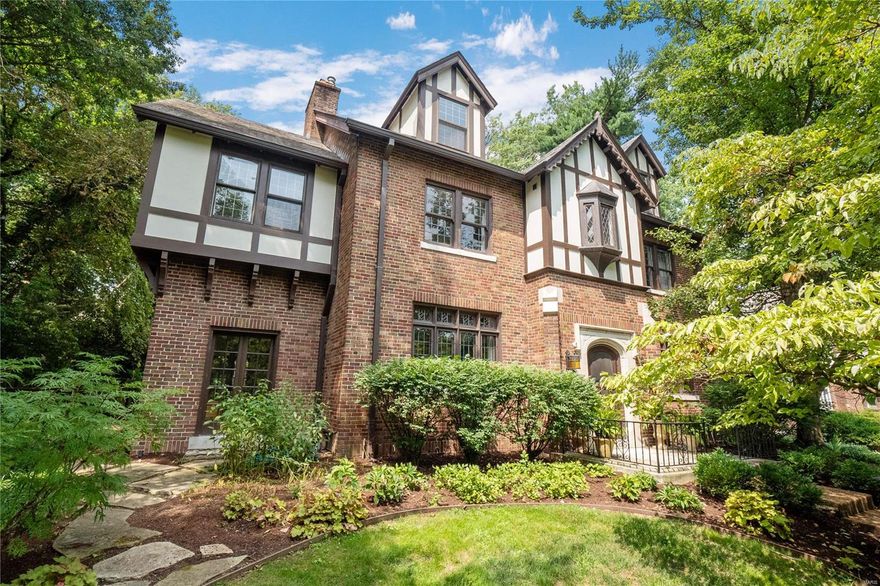 Historic charm & modern elegance combine in this gorgeous Tudor style home in historic Webster Park. Set off the boulevard, the large front yard is immaculately landscaped with lush beds & trees. Upon entry you will delight in details such as Saltillo-style tile in the foyer and sunroom, and leaded glass windows with stained accents. The living room features exposed wood beams & 20th century Arts & Crafts style tile mantle. Separate dining room & updated kitchen with modern conveniences including breakfast nook round out main floor. Second level features an expansive primary suite with bonus area, custom walk-in closet with laundry, and primary bath with jetted tub & shower. An additional 2 beds, full bath, impressive library & family room above the garage with bar complete the second level. Third floor features office & large additional bedroom with en suite bath. Lower level finished rec room & full bath add flexibility. Back yard is an oasis with large brick patio & fireplace. Additional Rooms: Sun Room
