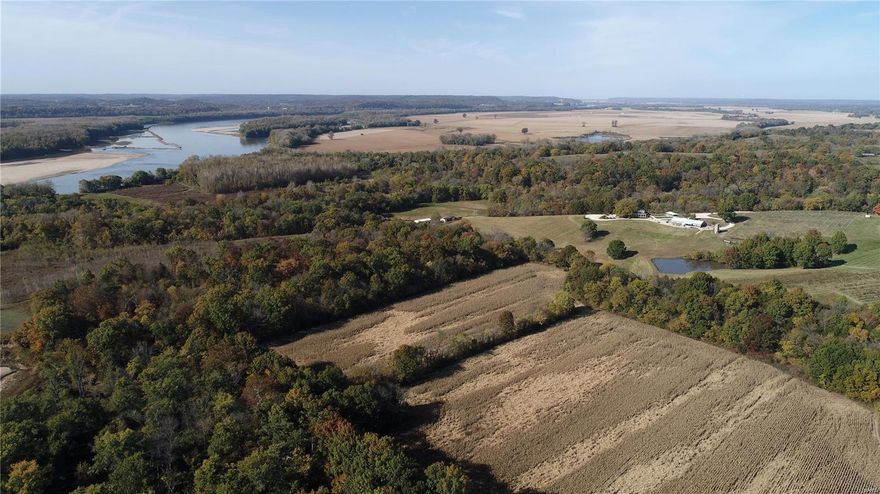These 204+/- acres are just west of Marthasville, minutes from well-known Hermann along the Missouri River in Warren Co. This property is a true recreational paradise with multiple revenue streams. There is currently 12+/- acres of vineyards, 21+/- acres in tillable production, 50+/- acres enrolled in WRP, 2 stocked ponds, .75 miles of Lost Creek frontage, & .70 miles of Loutre Slough frontage. The property is equipped with a fully renovated ~2,000 sq. ft. 2bd./4ba. home with a covered wrap around porch, a 55’x100’ shop, a 30’x30’ pole barn, & direct access to the river & Katy Trail State Park. There is a long list of equipment & tools that are included in the sale, with an option to purchase Lost Creek Vineyard wine equipment & inventory. The current owner is willing to provide consultation on vineyard & wine operations if a new owner desires to continue the vineyard business; call for more details. The views, serenity, & diversity of this property are literally one of a kind!