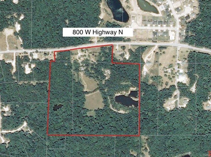 Back on the market due to no fault of the seller.  37.98 Acres with a mixture of woods and open fields that includes a stocked lake and a pond for your enjoyment.  First time on the market, this property would make a wonderful estate or for the discerning investor could easily be developed into a subdivision.  This property borders Wentzville so could be annexed into Wentzville with water and sewer right across the street.  This section of Hwy N is being heavily developed with subdivisions and estates.  Mobile home on the property is a tear down and being sold "As Is".  This property is loaded with wildlife so hunters take notice. Listing agent must accompany buyer.  Seller is willing to divide - see agent for details.  Don't let this one get away.