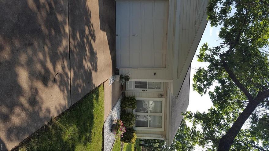 NO SHOW UNTIL OPEN HOUSE 7/31/16 11-1 This adorable 2 bed, 1 bath home has an open concept floor plan with newer flooring throughout the living room/dining room combo. The kitchen has very nice ceramic tile and a skylight for tons of natural lighting during the day. Laundry room is off the kitchen and has folding doors for easy access. Full bath has been recently remodeled with toilet, light fixture, bath/shower combo, new shower head and new vanity. The large master bedroom has a huge closet (length of the entire wall) and sliding glass doors that lead out to a fenced-in backyard area. Second bedroom is used as a nursery but is a very good size as well. Has a 1 car oversized garage with tons of storage. Driveway can fit 3 car spaces and extra parking is on other side of street. Common ground area on right side of house. Association takes care of grass cutting, leaf removal, shrubs and termite treatment. There is also a community pool perfect for hot summer days! HOME WARRANTY INCLUDED