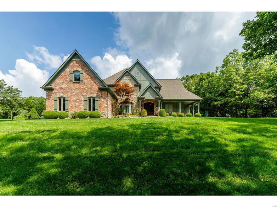 You have found paradise in this incredible custom built home where wildlife abounds. Nestled on 5+ lush acres this magnificent 1.5 story is a step above the rest. The finest craftsmanship & quality is featured thru-out.The moment you step thru the 8ft custom Mahogany doors into the 27ft entry foyer w/winding staircase you will know you have arrived home.This home was built for entertaining w/its well designed open floorplan. Special wide plank hickory flooring thru-out the 1st fl, 2-story 26ft stacked stone FP in great room including 2 massive custom built Amish timber frame beams nestled in the eves. Gourmet kitchen boasts custom cabinetry, substantial counter space, 2-tiered cntr island w/granite counters, Wolfe stove, SS dishwasher, professional grade built-in fridge & wine cooler. Octagon Breakfast Rm overlooks the built-in pool w/amazing water features/lighting. Hearth rm w/built-in cabinets & FP. Huge Mstr B/R suite on main level heated travertine flrs w/luxury mstr bath & more!! Additional Rooms: Mud Room