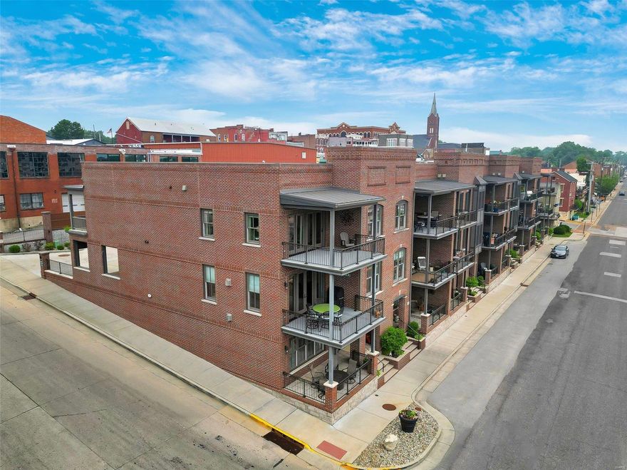 PRICE IMPROVED FOR YOUR DREAM. EXCEPTIONALLY WELL BUILT, ENERGY-EFFICIENT LUXURY HOME w/ MO RIVER VIEWs! An IMPRESSIVE grandeur façade w/ the perfect mix of brick, stone, aggregate, elegant windows, doors, grand white columns & beautifully maintained outside spaces on every level. This lovely townhome w/ 3 full finished floors has a walk-out LL w/ a full bath, family/rec area, Gas FP & more. The main floor boasts a customized kitchen w/ stylish cabinetry, 2 tone island cabs w/ granite tops, stainless apps, a walk-in pantry, & huge brkfst bar all open to the Dining & Great rm w/ FP. Most notable, 10' ceilings, extra thick inner wall & sound batting, custom moldings, solid flrs, wrought iron rail systems, ELEVATOR, 4 covered decks w/ spectacular views, VERY LG MASTER w/ ensuite office, full bth w/ onyx shower, frosted glass drs, lg dbl onyx top vanity, walk-in closet w/organizers, oversized single garage, carport & add'l offstreet parking in private street. Don't miss this VIEW-Call Now!