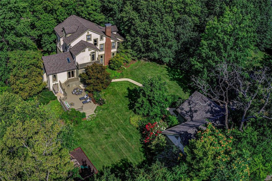 This exquisite Tudor artfully unites classic features and architectural details in this luxurious renovated residence on nearly one acre with sweeping lawns and professional landscaping under a canopy of trees. The chef's kitchen featuring Wolf, Sub-Zero and Asko appliances opens up to the hearth room w/vaulted ceilings and stone fireplace. The Butler's pantry leads to the elegant dining room which flows gracefully into the living room and to the light filled sunroom. The 2nd floor features the master suite complete with spa like bath w/steam shower and claw foot tub as well as an attached sitting room w/ custom closet, laundry closet and access to private balcony. Additionally, on 2nd floor, you'll find the family room, full bath and 2nd bdrm. The 3rd floor boasts two additional bdrms, Jack & Jill bath and a playroom/office. Magnificent lower level with entertaining kitchen, media room, full bath, hobby room w/laundry and bonus room. Serene grounds, 4 car garage, such a special home. Additional Rooms: Sun Room