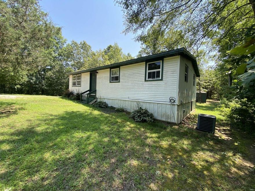This secluded property offers 23 acres of privacy.  Enjoy sitting out by the pool on your oversized covered deck.  Manufactured home offers may updates.