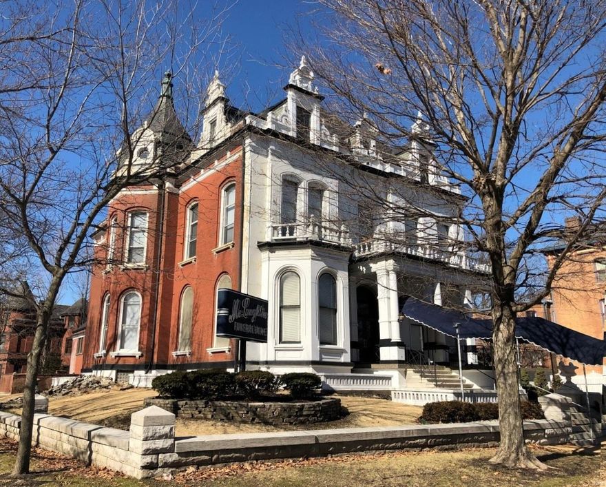 Spectacular opportunity to be a part of Lafayette Square with over 10,000 sf of living space and facing Lafayette Park. This home features a great deal of historically significant and interesting architectural features and charm that will leave you breathless. Victorian facade with large arched windows, ornate brick and stone work, exterior decking with large stone balusters and rails, slate roof, custom copper finials, perimeter dentil work, stone walls, custom iron fencing, large urn planters and beautifully painted front. Interior is equally impressive with handmade, custom woodwork throughout, 14 foot ceilings, historic crown molding and beams, art glass windows, wall murals, period lighting, Missouri mined marble vanity tops and wainscoting, beautifully carved staircase, handrails, spindles, and cornice work. Currently used as commercial space but could be converted into the most impressive home in the Square! Comes with oversized 3 car garage and carriage house with apartment. Location: City, Corner Location, High Traffic