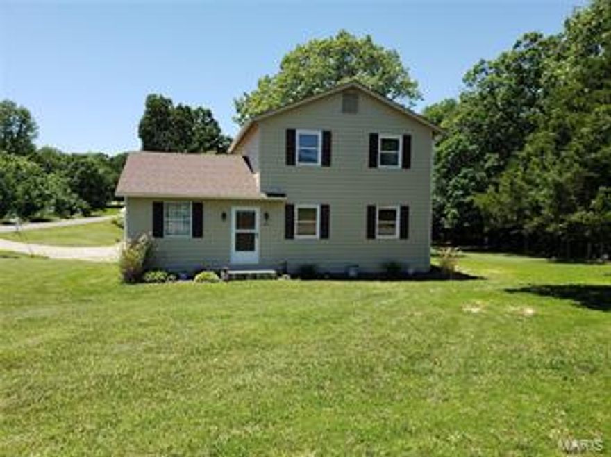 PERFECTLY  located residence with a 32x50 COMMERCIAL STYLE garage built just 2yrs ago located on almost a full acre corner lot.  Residence features 3 bedrooms 2baths and a 1 car attached garage. The property also boasts a BEAUTIFUL shaded yard that backs up to a small dry creek outlined by woods.  Garage is set up for any type of fabrication or mechanics needs.  It features 3 bay areas, 200amp service and air hookups through out.  All this and you are just minutes away from all the amenities of living in town and access to the I44 interstate.