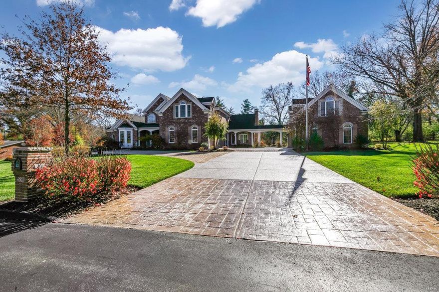 Exquisite home on 1 acre, level lot in Frontenac w/ carriage house apartment for guests, family or sheltering at home. This stunning home features gracious arched doorways, 2 stry foyer, 7 tiers of crown molding and wainscoting in dining rm. The gourmet kitchen, eat-in dining and hearth room with surround sound and stone fireplace. Mud room off the laundry w/ bench and coat hooks. The home is wired for sound throughout. The main fl. master suite has His & Hers closets and a luxurious bath with a heated floor. The 2nd fl. features 4 bedrms. 2 with private baths and shared Jack & Jill bath. The large bonus room has a wall of built-ins. The lower level is finished with a Family room, exercise area & offc space, full bar, lounge area and full bath and plenty of storage. The woodburning fireplace on the back patio and hot tub, just off the covered porch, lends itself to great outdoor entertaining. room to add your own private pool. Large aggregate drive provides ample room for entertaining.