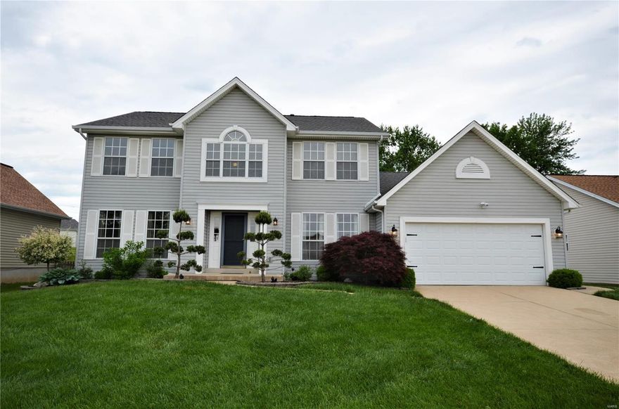 WELCOME HOME to 3765 Cambridge Crossing Drive, a meticulously cared for 2-story in highly sought after Oak Grove Bluffs.  Francis Howell Schools!!  From the moment you step inside this MOVE-IN-READY home you will be amazed at the fresh and open floor plan w/ impressive T-shaped staircase.  The entry foyer has 2 coat closets & the house flows nicely from room to room.  There is over 2,400sf of living space, one of the largest in the subdivision!!  The Master Suite is a dream, complete w/ luxury bathroom (dbl vanity, separate tub/shower), sunshine-filled Sitting Room & large WIC.  Three more large bedrooms round out the 2nd floor.  The Kitchen has matching stainless steel appliances, center island & planning desk.  New carpet and lighting throughout the house, large private fenced backyard with large patio & oversized 2-car garage with extra workshop area.  And did I mention the landscaping & curb appeal???  Home Warranty included.  Don't miss your opportunity to see this special house!! Additional Rooms: Mud Room