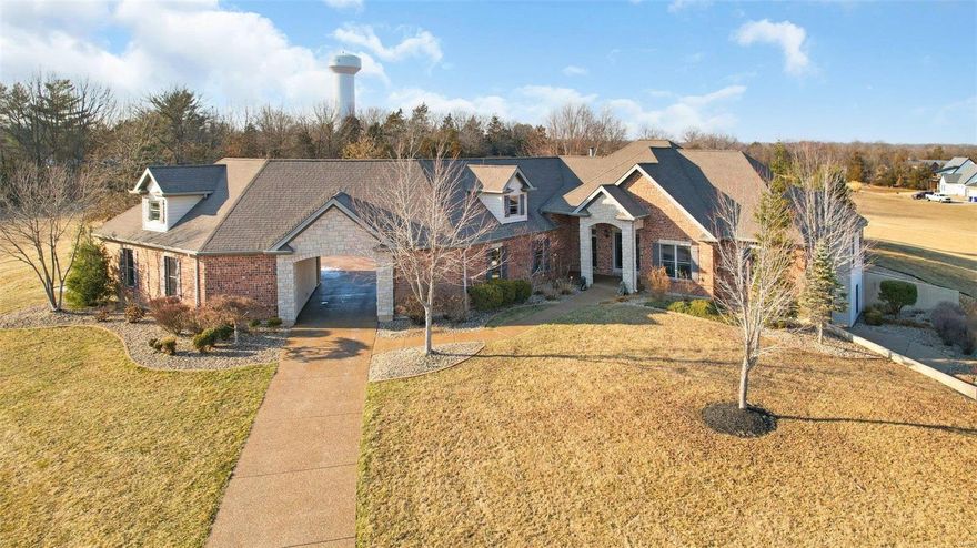 A remarkably long aggregate drive leads to a stunning ranch home on 6 acres with a pool.  The home consists of 5 bedrooms and 3.5 baths which is perfect for raising a family but also an entertainers dream with plenty of open space throughout the kitchen and family room/hearth area. Off the kitchen is an oversized pantry, laundry room, mud room and half bath. Centrally located in the home is the sunken living room and just outside 2 Anderson sliding doors is a covered patio that leads to a beautifully landscaped inground pool. The lower level of the home has a cozy, rustic theater and bar area, 2 additional bedrooms and full bath as well as a mirrored workout room. Impressive attributes include 9 and 12 ft ceilings, Sonos system throughout interior/exterior of home, Assurance security system with 3 Hik night vision cameras, 1 heated oversized garage and 1 heated/cooled oversized garage with water and air compressor piping. Located within 5 min from Hwy 70 and 10 minutes to Wentzville. Additional Rooms: Mud Room