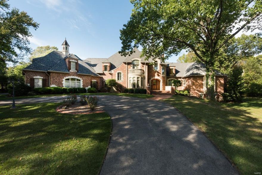 Peaceful Unique Luxury in the ideal Ladue setting. Architecturally custom 5 Bed/10 bath home designed by William D. Cover & built by Lisk Homes. Perfectly situated on almost 2 acres in a serene neighborhood. This estate home has 9,895 sq ft of finished space featuring amazingly well conceived upgrades. Chef’s kitchen/wine cellar/850 square foot bonus room/7 Fireplaces! A True Culinary Destination in your own home, this kitchen is every bit as functional as it is beautiful without a feature missing. Custom spice cabinets/cooking utensil cabinets/Wolf stove/dual fuel ovens/Walk-in pantry/chef’s library/Dacor baking oven/Meile espresso machine/pull out marble slab! Hearth rm 20 ft tall stone fireplace/cathedral wood ceilings/exposed Douglas Fir timber beams. European style Sunroom/potting station. 6 climate zones/Pella windows. Master features sitting area/fireplace/French doors to patio/His&Her's Closets & Bathrooms. Finished LL masonry fireplace/bar/wine cellar. Additional Rooms: Mud Room, Sun Room