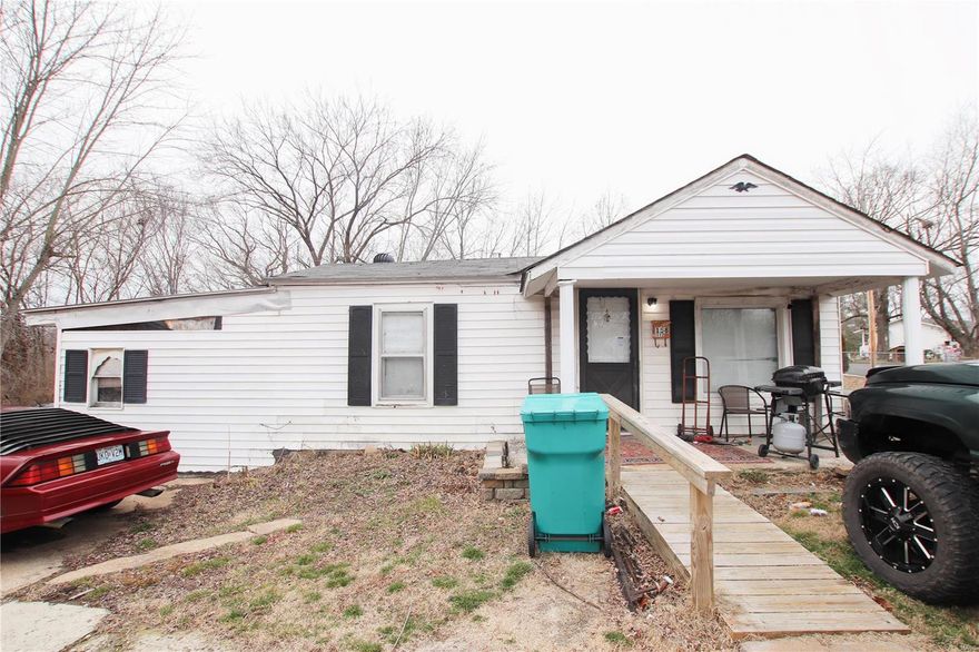 Investment property and the fixer upper you have been waiting for!  Located close to I-44 this fixer upper is ready for you to make your own.  2 bedroom, 1 bath, 1 car metal building with concrete floor and electric, and an extra storage building in back with small lean-to.  Seller is selling as-is.  Seller will have everything cleaned out prior to closing. Adjoining commercial building (former tire shop) for sale right next door.  MLS 23002590. Opportunity to own both!