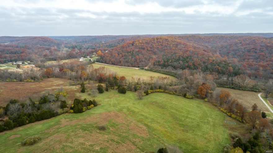 279.9 surveyed ac located off Fox Creek Road in Wildwood, MO. The ground is divided into approximately 50 ac of pasture ground and 125 ac of mature timber. It has a blacktop road to the private gate & has many locations w/ gorgeous scenic views upon which you could build your dream home. Fox Creek meanders through the front part of the farm. There are a couple of areas where small ponds once were located & could be restored. Trails run throughout the farm for endless hours of recreational or horseback riding. Wildlife is abundant on the farm w/ multiple sightings of deer, turkey & various small game. Hunting pressure has been very light over the last 15 plus years. There are also a few large tracts of land in the area including 1,880 acres of MO Conservation ground known as Rockwoods Reservation right across the street on Fox Creek Road. Electric power is close by. There are not many opportunities to purchase this size tract of good recreational land this close to St. Louis.