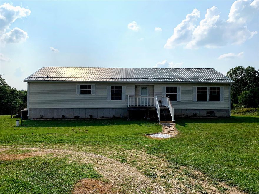 If you're looking for something beautiful, quiet and secluded this one is for you! This all electric 3 bed, 2 bath modular home offers over 2,100 sq ft of living space and sits on 36 +/- acres. Updates include a new metal roof and beautiful granite countertops added in 2017 as well as an unfinished, walk out basement. Home has an open concept with a kitchen/dining combo. It also has a den/office and owner currently uses one bedroom for in-home gym! Property offers a pond and hasn't been logged since 2005. There is also a 10x16 storage shed. The backyard is big and spacious and backs up to woods. Lots of hunting opportunity here! Schedule a showing today!