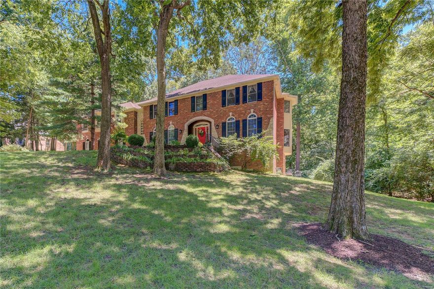 OPEN HOUSE CANCELLED. Stately home on 1.01 acre with 3 car, that backs to McNair Park! Live great in this beautiful estate that boasts over 4000 sq ft, plus approx 800 sq ft in the finished, walk-out LL with new carpet and paint. Wood flooring in your grand entryway with vaulted ceiling and exposed staircase. DR is fit for a king and queen with enough room for an x-large table, built-in shelving, detailed millwork and a secret, hidden closet that just adds to the wonderful charm. Wide open layout in the rear of the ML that allows the kitchen to flow through to the FR with large fireplace, new laminate flooring, box beam ceiling, wetbar and office with built-in bookcase. Updated kitchen with solid surface tops, center island, brick hearth and 2x oven. Master Suite with updated Master Bathroom has 2x sinks, separate tub and shower and 2 walk in closets. 2 secondary bedrooms have their own full bath and the other 2 are jack n' jill style. Additional Rooms: Sun Room