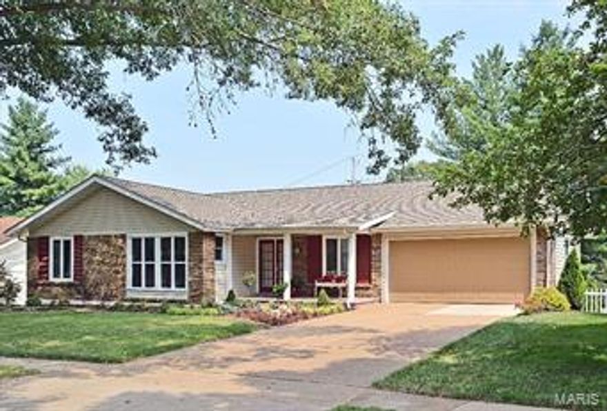 Beautifully remodeled Chesterfield ranch with lots of curb appeal.  The interior incorporates 4 bedrooms, 3 full baths and approximately 3,000 square feet of comfortable living space.  Special amenities include a brick front elevation, hardwood and travertine flooring, updated lighting fixtures and neutral paint. The main level boasts an open floor plan with a living room, dining room, and hearth room. The kitchen's decor includes 42" flat panel cabinets complimented by a stone backsplash, granite counters, stainless appliances and a raised breakfast bar with pendant lighting.  
The walk-out lower level is tastefully remodeled and wide open including a wet bar, rec room, a bedroom with walk-in closet and ample storage. Set on a beautifully landscaped 1/4 acre lot with a privacy fenced yard, deck and stamped concrete patio, this home is located just minutes from some of West County's best shopping, dining and access to I-64.