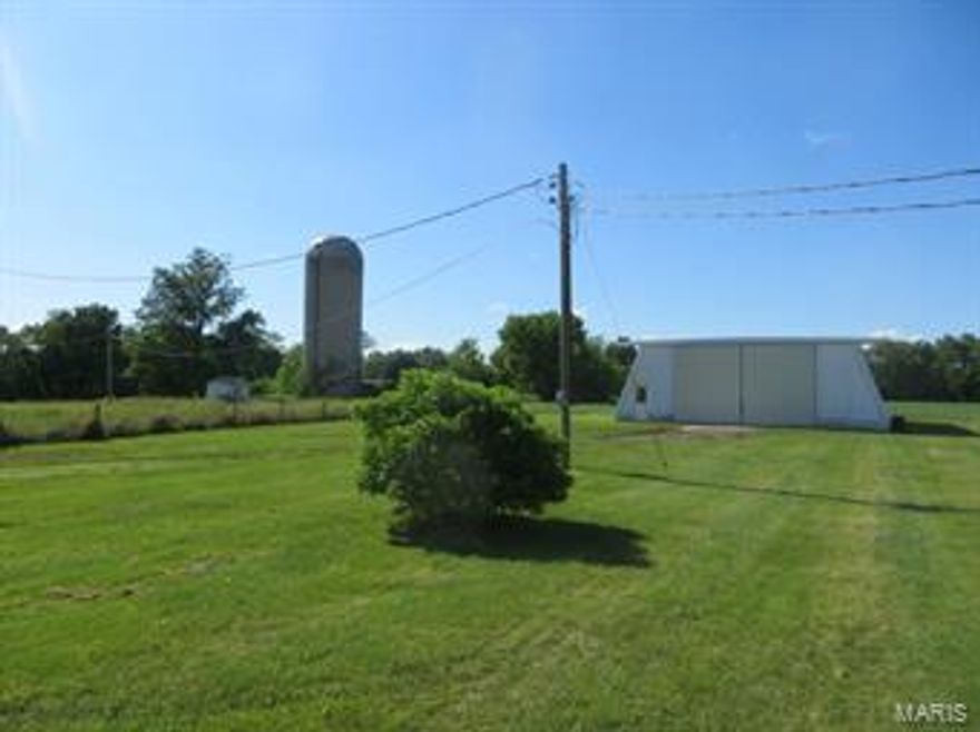 Here is a great opportunity to own your very own mini-farm in St Charles County. This quality built, full brick 4 bed, 3 bath ranch has a great floorplan and full basement with partial finish. Million dollar location and views. Mature landscaping and trees. 13 open acres with a mix of pasture and some tillable ground that could generate some income. 4 acres of woods. Pasture ground is rolling and beautiful. 48 x 76 engineered steel machine shed with concrete floor. The upright silo is still in tact. Cattle feed floor and some structures are still on site. Not many parcels like this come available in St Charles County