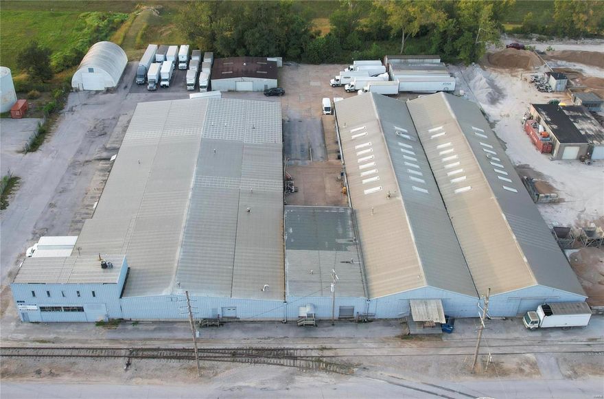 For sale is a versatile industrial building offering approx 62,392 square feet of warehouse space on 2.8 acres. Built in 1964, this facility blends historic character with modern upgrades, making it ideal for single or multi-tenant use. It features some modern updates as well as a flexible layout that accommodates multiple tenants, modern infrastructure including numerous docks and drive-in doors, and a spacious interior with some ceilings reaching 20ft at center. The property is strategically located with easy access to HWY 141 and I-44, has rail access, ample tractor trailer storage, and permitted outdoor storage for additional equipment. Amenities include well-appointed reception area, executive office spaces, conference room, bullpen area, and kitchen break area. Secure and outside of flood plains, this building offers both functionality and peace of mind. Contact us to arrange a viewing of this exceptional property. Location: Industrial Area