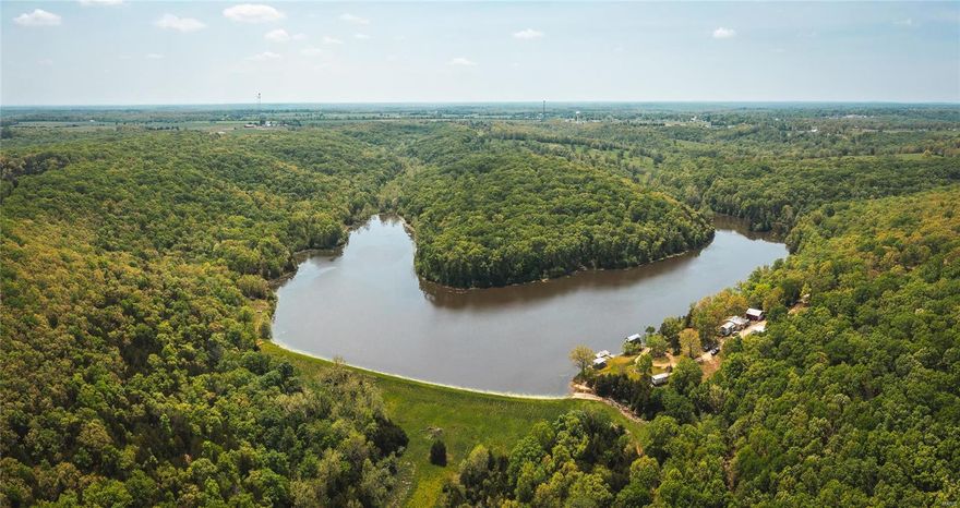 Looking for the perfect recreational property, own your own piece of paradise on this 230 acre farm with an incredible 25 acre lake that is well stocked with trophy bass, bluegill, and catfish. House site placed strategically to enjoy the view of the lake with easy access to boat docks and fishing. This land is a sportsman’s dream offering great turkey, deer, and small game hunting. The lake attracts many waterfowl species each year and would be a perfect place for the duck/goose hunters as well. Get the remote back country feel but located just a few short minutes from Belle, MO with all the necessary small-town amenities. Accommodations currently are a trailer with built on rooms including 3 bedrooms and 1 bath. Also has vault style concrete room for storage. Great future building home site and could easily be divided to offer family member lakes access. Don’t miss out and call today.