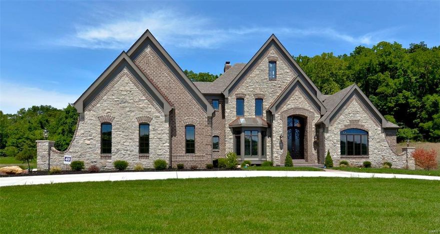 New Construction, Chesterfield, Rockwood Schools! SPECTACULAR Home in The Arbors at Kehrs Mill! Crafted by St. Louis' premier hands-on builder, Claymont Development, LLC-Wesley Byrne. The "Kennedy" is a sensational 5BR, 6 Bath, 1.5 Story Home with over 6000 sq ft of exquisitely finished living space. Exterior Elevation features a warm blend of brick & stone; The impressive Elegante Iron entry door invites you in; Gorgeous millwork throughout; Andersen wood windows; 10' main floor ceilings with 8' 2-panel, doors; 4-car side entry garage; Huge Gourmet kitchen featuring custom cabinets, Thermador appliances, granite counters, large center island/breakfast bar; Luxury Master Suite w/ whirlpool tub & separate shower plus His & Her closets. Three BRs & 2 full baths complete the UL;  Outstanding Lower Level Finish features full mason FP, brick/stone wetbar, huge rec-room, 5th BR & a full bath! Outdoor hearth room with full mason FP & SS Grill on three tree-lined acres; Backs to common ground