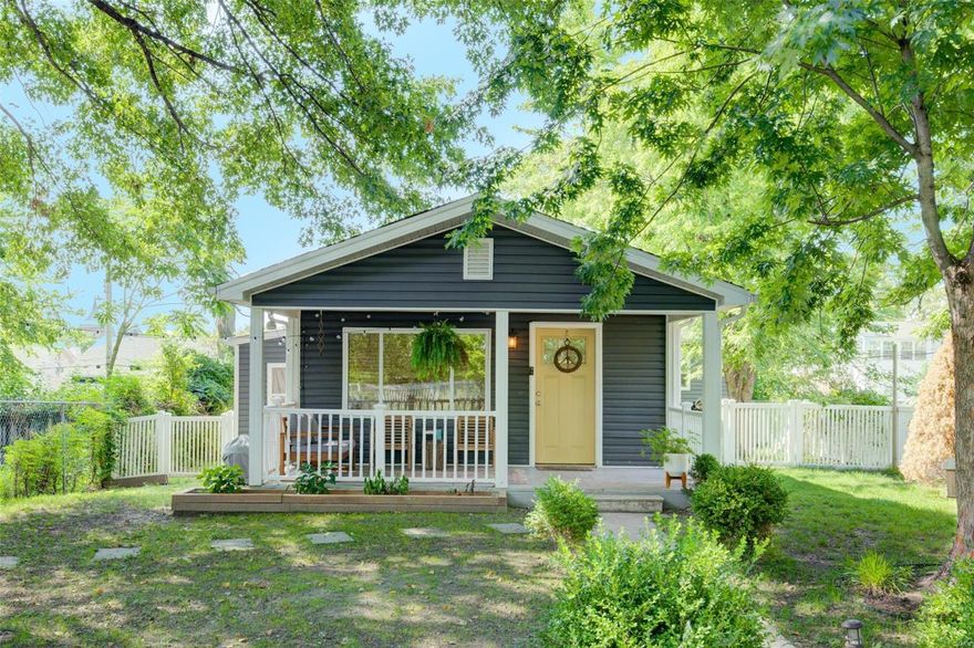 Tucked-away from the road, sits this charming and updated home. The large fenced-in front yard, is a great space for entertaining or providing your fur-babies a place to play. There is a rock garden area with pavers that lead to the large covered front porch. Once inside you will notice many of the charming details and updates throughout the home. The living room flows into the galley style dining and kitchen area. Here you have white shaker cabinets, granite countertops, subway tile backsplash, SS appliances, and bar top area with open shelving. A large pantry is tucked away providing convenient storage. This home features 3 bedrooms. The primary bedroom suite features a private full bathroom. There is main floor laundry area, and a second fully updated bath. The cellar style basement was professionally waterproofed and offers additional storage. Recent updates include: new wiring and panel (2015), new roof (2015), new HVAC/water heater (2015), new vinyl fence and vinyl siding (2015).