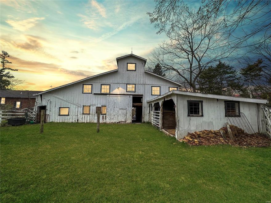 Expansive 4.35 acre lot close to Queeny Park and suitable for horses! Secluded at the back of the neighborhood, a private driveway takes you from the cul-de-sac to your property. This partially wooded lot is being sold as-is and is the perfect place to build your dream home. Gently rolling hills, trees, and both paved and dirt roads complete this blank canvas lot. Please note, there is no access to structures on the property during showings, this is being sold as a building lot.