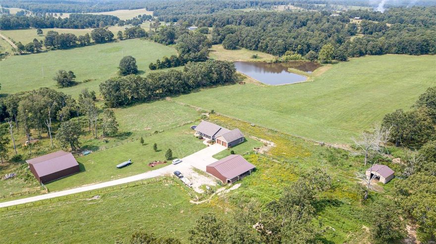 WOW! This property has so much to offer. 2 different homes.  The 1st one is a 5 bedroom home with full walk out basement.   Master suite with large walk in closet and bathroom with custom shower and free standing tub.  Great room set up with kitchen that has every detail you would want.  Oversized laundry, rec room, office space. 50x50 barn, 30x50 shop with 4 stalls, 24x24 pole barn, 2 ponds stocked, fenced - 6 ft, but folded down so wildlife can graze through. The 2nd home is a 4 bedroom, 2 bath ranch style home which is rented. 24x32 detached garage, 32x36 barn, 70x50 feed shed and a working Equatic Fitness facility and indoor arena (100x240)!! The equatic center has a 40x120 pool, solarium, 14 stalls, booth, kitchen, food area, HVAC, restrooms and showers.  100 acres m/l, much of it is pasture ground.  Has amazing potential to continue as business or for personal use.  Also room to expand.