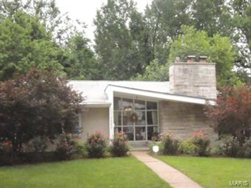 Unique mid-century modern home in wonderful, walkable neighborhood. Lindbergh Drive is the street w/the median, making its houses private and quiet. Upon entrance, you'll find a vaulted ceiling and wall of windows in the LR/DR; a woodburning fpl has a stone surround. Kitchen has granite counters and newer stainless appliances. 3 bedrooms share the updated spick-n-span bathroom, or use the LL walk-in tiled shower. Walkout LL gives the feel of a loft, making it great entertaining space. 2 piece bar is not built in but may be included if the offer is right.  A deck overlooks the most serene yard around... imagine warming up at the stone firepit or reading a book by the pond with gurgling waterfall.  Sellers replaced all wood floors on first level, painted and added lots of landscaping. For inspiring spaces and a true sanctuary, you've come to the right address.