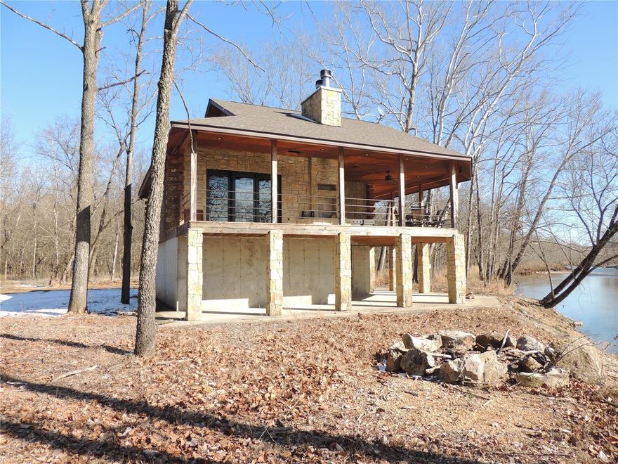 Whitetails!! Small mouth bass!! Turkeys galore!!  This property is the outdoorsman playground.  Nestled amongst towering oak trees with a picturesque setting just a few steps from the Mineral Fork River is a well appointed cabin with all the luxuries of home. Masonry fireplace inside and masonry fireplace outside offers the best of both worlds. The interior is rich with reconditioned barn wood walls, granite counter tops, custom cabinets and more. Powered by two generators and propane this climate controlled getaway makes you feel a thousand miles from home. With a number of trails, forest management, clearings for deer and turkey, this is a must see property just a little over an hour out of St. Louis and easy to get to is a little piece of paradise.