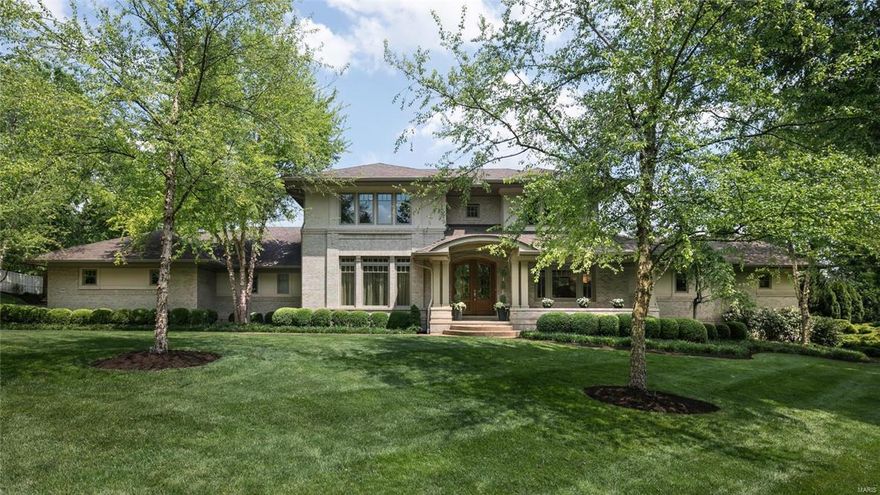 Incredible new price on this exceptional 11 year old home in the heart of Ladue!
 This 4bd, 4+bath home offers an open floor plan, arched doorways, wide plank maple wood floors and spacious room sizes throughout. Main floor master suite w/ spa-like bath, private laundry and large walk-in closet with custom built-ins.The chef's kitchen with stainless appliances and honed granite counter tops & custom Markus cabinetry opens to a wonderful hearth room with vaulted ceiling and gas fireplace. Butler's pantry with subzero wine cooler, formal dining room with coffer ceiling , 2 powder rooms, den/office and living room with soaring ceiling height, built-in bookcases & second fireplace.  Upper level boasts 3 beds and 2 baths, walk-in closets and  laundry room. Finished lower level with additional family room, wet-bar, exercise room, craft room, & full bath. 
 Patio overlooks custom saltwater pool & hot tub is perfect for entertaining!
 3 car attached garage and lovely manicured grounds.