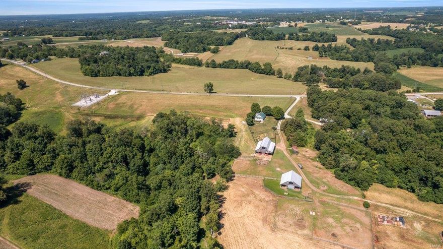 Approximately 161 acres with a well cared for home. This package includes several outbuildings 40x81 quonset hut, 50x60 barn, 26x60 equipment shed, 30x66 equipment shed and 48x44 barn. It's the perfect set up for your own cattle operation. Pastures are fenced and cross fenced for easy rotational grazing. Barn lot is set up with waterers and 2 ponds are on the property as well as a water hole for livestock. Approx 50 acres of woods offers hunting opportunities for deer and turkey. The home features some updates and maintains original wood floors throughout most of it. The yard is nicely partitioned off with wood fencing and there's room for a garden. You'll experience true country living at this property. Hwy Y intersects the property and could easily be split if you desire. Duplicate listing of MLS # 22042319