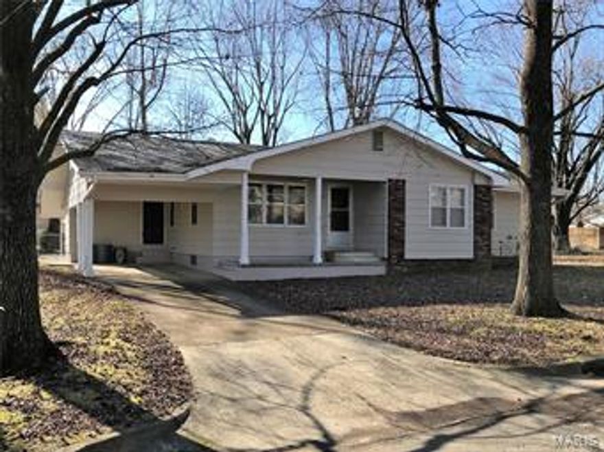 Large Bedrooms, nice updates, and full partially finished basement with this 3 bed 2 bath home located on double lot.  Kitchen is open to dining room, has updated counters & cabinets, large sink & big window that overlooks chain link fenced backyard.  Spacious living room.  All 3 bedrooms are generous sized & on the main level.  Full main floor bathroom has been updated with pretty counter, sink, mirrors, and light fixtures.  Full part finished basement has 2nd kitchen area.  Could also be recreation or family area and laundry hook up, updated floor. Attractive 3/4 bath has tile flooring and walls & low entry shower.  Two huge storage areas as well.  Nice covered carport has entry into the enclosed back porch area.   Covered front porch & covered back patio.  20x24 m/l, nice shop with 1 garage door, concrete floor, finished walls, electric, propane heater.  Attached storage/utility shed with lights and ramp for mower storage.  Home has much to offer & is ready for new owner.