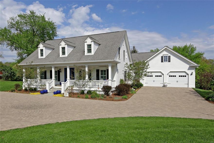 A One-of- a- kind Jewel- in the heart of Ladue! This newer construction white cottage style 1 ½ story home, boasts an inviting porch across the front w/new doors exuding superior style, quality & craftsmanship. Flowing floor plan features wood floors, gallery entry foyer, spacious living & dining rooms. The back of the home offers the casual space everyone desires – newer kitchen with custom cabinetry/breakfast room/hearth room with fireplace and built-in bookcases, opening to a private enchanting garden  designed with 2 patios, fountain & beautiful plantings. Don't miss the updated half bath, office, laundry room & attached 2 car garage. Master Suite with new wood floors, two walk-in closets & newer spa-like Master Bath. The second level includes a landing large enough for a casual sitting area, 3 bedrooms & 2 full baths.  Finished lover level provides an additional 1,100 sqft of living space including a recreation room, full bath & ample storage. Don’t miss the List of Improvements.