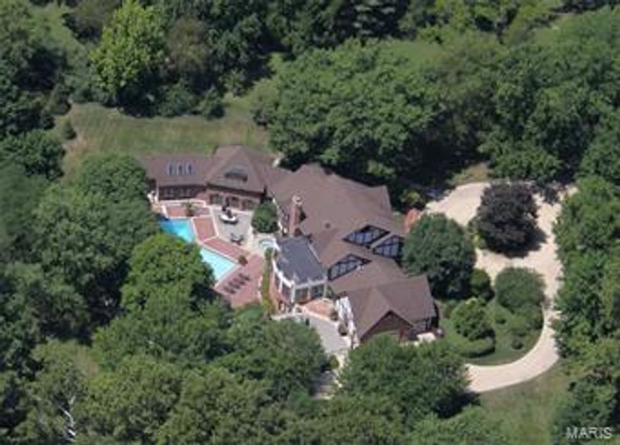 New Price makes this remarkable property even more compelling. Extraordinary, World-Class and One-of-A-Kind.   Huntleigh Estate,  maintains its low profile from the street and then opens to the back to become one of the most extravagant and opulent homes of record, in all Saint Louis. A stately equestrian property in exclusive Huntleigh. This fine home has been home to numerous fundraisers, philanthropic events and some of the greatest parties in town, amid terraces, patios & a magnificent salt-water pool. Capacity for a crowd of up to 400. 10,550 SF*. 3.4 acres. 4BR/8BA  Main Level Master addition; open floorplan. Massive Gourmet Kitchen w/multiple granite islands; Wolf, SubZero & Asko appliances. Vaulted Hearth room. Built to commercial standards w/concrete, steel, and solid wood doors. Soundproof and Energy efficient. A walkout Lower Level is 3000SF w/ a full caterer's kitchen and entry. [*7550 SF 1st+2nd +3000SF LL]