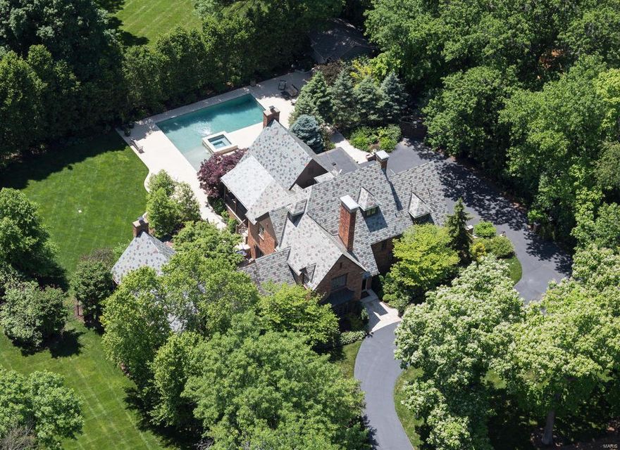 The very finest of homes in Historic Hampton Park. This 5,600 square foot English Tudor at 1167 Center Drive is fully recreated in every amenity, convenience, luxury and finish, both inside and out, overseen by Alan Brainerd, Design. The Main Level Master wing and vaulted Hearth Room additions are invaluable living spaces, now showcase signatures of this exceptional home. Private, fully enclosed grounds offer a newly configured Pebbletec saltwater pool and spa, with patios and custom landscaping detailed in boulders, tiered flagstone patios, stone retaining walls, and intricately designed lighting. All baths are fresh, with modern updates in the highest level of finishes. Additional living in the completed lower level provides state-of-the-art bar, media and gym.  Over $500,000 has been invested in design and improvements, since purchase in 2012. New garage and new laundry. Slate roof. 3 New HVAC systems. Tint windows and doors. Ideal Central location.