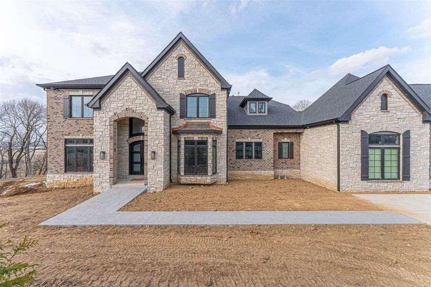 Exceptional new construction opportunity w/ up to 6500+ sq ft of pure indulgence, offering 4 beds (5 or 6 bed layout offered) & 3 1/2 baths. Prepare to be enchanted by the high-end finishes throughout, showcasing exquisite craftsmanship and impeccable attention to detail. The luxurious main floor primary suite is a haven of tranquility, while the amazing kitchen w/ a beautiful hearth room is perfect for culinary delights and intimate gatherings, and all of the other common spaces exude an inviting yet sophisticated feel. The optional lower level finish is a true entertainment oasis, featuring an amazing theater room, well-appointed bar, and a recreational space that seamlessly connects to the outdoor hearth room. Situated on over an acre of land, this property offers captivating views that will leave you in awe. With a 4-car garage, parking and storage are never a concern. Located on one of Chesterfield's most coveted streets, the address alone exudes exclusivity and prestige.