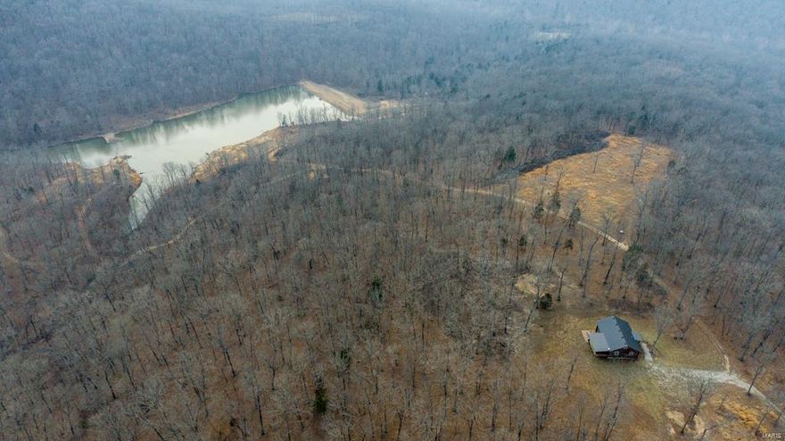 Located at the end of a private lane this 292 acre recreational paradise affords you, your friends, and your family complete privacy, while still offering every amenity one could ask for. Nestled perfectly on a Crawford County ridge top, the well-thought-out and maintained cabin is one of a kind that you must see to truly appreciate.
The cabin boasts approximately 1,200 square feet of living space, 2 bedrooms, a large loft, one full bath, laundry room, hardwood floors, screened-in porch, concrete patio, and 200 amp service.
Whether you are chasing whitetails during the rut, big toms in the spring, or flipping jigs during the spawn you could never be disappointed with this one. The farm has a proven track record of excellent deer and turkey numbers while the lake was built specifically to provide top-notch fishing. A well-established SxS trail system will lead you through 292 acres of mature timber. The property is turn key.