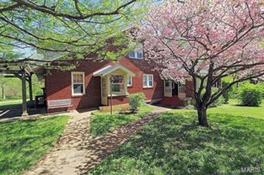 Unique find in the city limits, 1 1/2 brick/vinyl home sitting on 7 acres more or less with 56 x 36 shop with electric and concrete floor.
This lovely 5 bedroom, 3 bath home is filled with charm and character. Main level includes a spacious living room and fireplace with
gas insert, updated kitchen with new counter tops, stainless appliances & separate dining room. The main level master bedroom with adjoining bath is also a plus, along with den/office for multiple purposes. The upper level has lots of space for a growing family with 3 additional bedroom, one with an adjoining 12 x 11 room would make a great play room. This is a must see to appreciate property with several outbuildings, large yard, circle drive, and numerous other updates making this a perfect forever home! Call for a showing today.