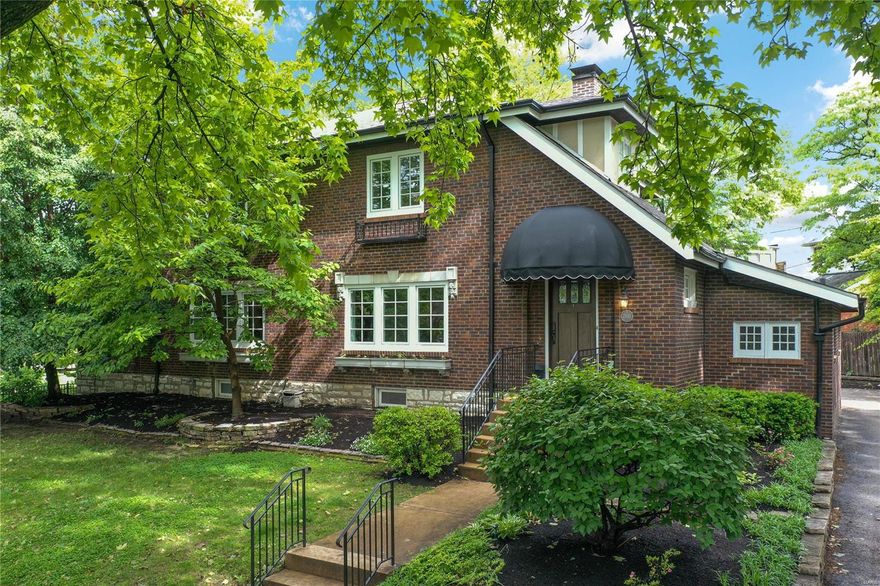 Step into the best of Clayton living on the picturesque Wydown Blvd. This delightful home boasts an open floor plan with spacious living room featuring showcase custom mantel & wood-burning fireplace, large dining room off the kitchen, and a bright sunroom. The cook's kitchen is complemented by a window-walled family room that overlooks the serene Wydown Park.  Upstairs, you'll find a private primary suite with a sunny sitting room, 2 additional bedrooms, a hall bathroom, and a convenient laundry area. The lower level features an office and bonus rec room with a full bathroom, as well as add laundry and plenty of storage. You will LOVE the charming patio, beautifully landscaped yard and 2 car attached garage. Stones throw from Clayton's finest restaurants and patios, sitting front and center on the tree-lined Wydown Blvd, and offering the esteemed Clayton Schools. Hardwood floors throughout, freshly painted neutral decor, updated systems, new windows and new roof. This one is special!