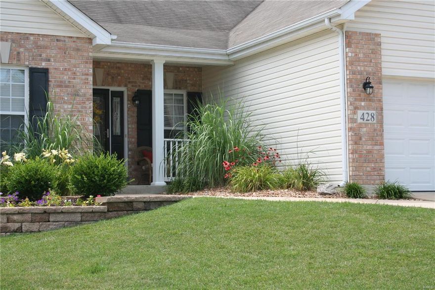 12' ceilings with a palladium windows in the great room. Custom, professionally installed stone work, from floor to ceiling, on the gas fireplace  in great room, with built-in shelving. This home has a Light & bright, wide open floorplan. 9' ceilings on main level. Spacious kitchen & breakfast room includes a center island, an eating area, & kitchen desk. A Gas Stove, Maple cabinets, beautiful solid surface countertops, and hardwood flooring make this house so appealing. Mudroom across from the main floor laundry. Master bedroom ceiling is trayed. Master bath has a whirlpool tub, double vanity, and a separate shower. Den/toy room could be made into a 4th bedroom or your office. Nicely landscaped in front & back. The covered patio off the breakfast room would make a nice "outdoor family room". Swing set can stay. The yard is fenced for your kids or pets. 3 car garage, great appeal inside & out. Convenient location. Close to all amenities.