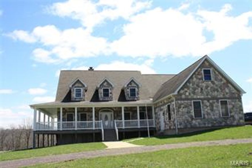 For nature lover who appreciates the beauty and solitude of the country side, this is paradise. Custom 2.5 story home sits in the middle of 382 acres. 1 mile of Big River that cascades down the eastern side of the property, spring fed lake, creek,  2 fenced pastures suitable for horses and the balance is wooded. For the outdoors man, hunting whitetail deer, turkey and small game, fishing the lake and river, horseback riding opportunities are endless. 4500 sq ft country home has everything to offer. Main level features great room/living room with floor to ceiling stone fireplace, upgraded kitchen with Viking appliances, master bedroom & bath w/ walk out access to the deck, formal dining room, foyer, laundry room, office, 2nd bedroom and bathroom. Custom oak staircases to the 2nd level with 1 bedroom, bath, fitness center, board room. 3rd level is look out room. Wrap around deck, hot tub, 36x40 4 stall barn w/ loft, 2 car detached garage. Back up generator and auxiliary wood furnace