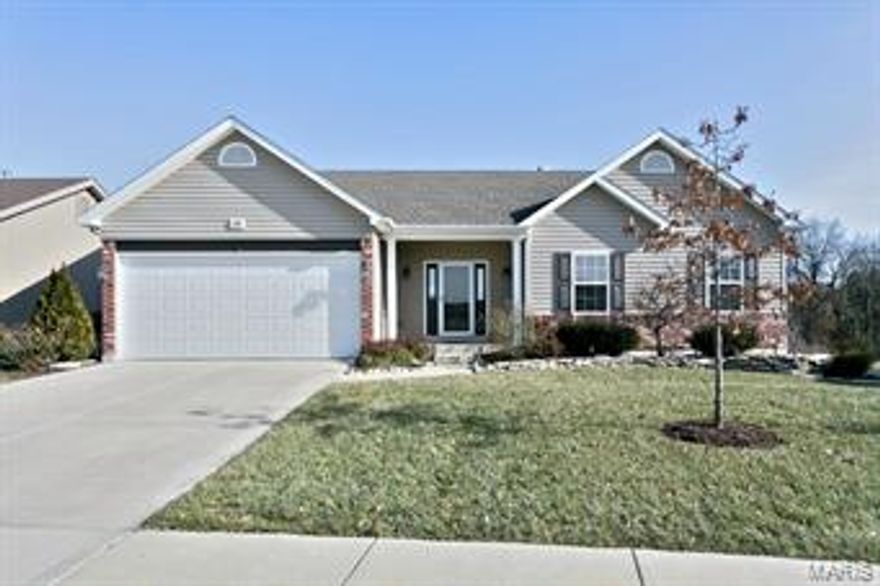 Darling ranch w/ tons of upgrades! The great room boasts cathedral ceilings & a gas FP. In the kitchen you will find upgraded staggered cabinets, an island w/a breakfast bar, breakfast room & sliding glass doors. Main floor laundry room w/ cabinets & a built-in ironing board. Spacious master suite includes walk-in closet, double sinks & separate shower & tub. Two more bdrms. round out the main floor, one w/ an additional walk-in closet. The main floor also includes extra tall trim throughout, brushed nickel hardware and fixtures, ceiling fans in master & great room, & two panel doors. Downstairs is an expansive rec room that was just recently finished w/ new carpet & paint and a rough in for a bar area which is finished with porcelain tile. The full bathroom in the LL has porcelain tile floors & shower surround. There also is a 4th bedroom w/ a walk-in closet, an office and doors that walk out to the large backyard & patio. 9' Tall garage doors and extra wide driveway.  USDA Financing!