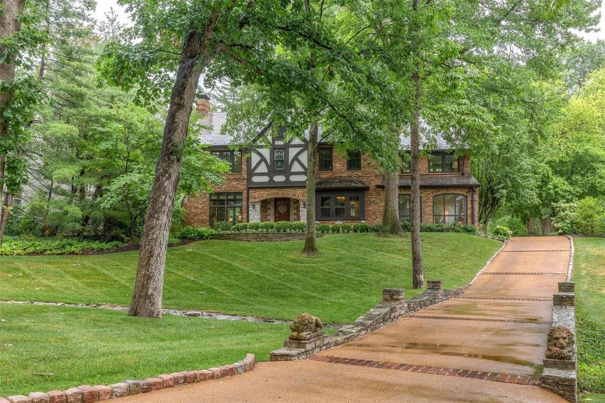 Classic Tudor Architecture in Premier Ladue neighborhood blends original workmanship with modern & stylish updates.  The flag stone walkway leads to handsome arched brick & stone covered entrance. Superb structure & abundance of windows gives warm welcome & fills every room with light enhancing high ceilings, moldings & built-ins. Beautiful Terrazzo floor & stone fireplace in living room; generous sized dining room with window seat; family room with floor to ceiling windows overlooks picturesque property. Updated kitchen embodies chic style with marble counters. Upstairs, 4 bedrooms, 2 baths. The master bedroom, a private oasis bathed in light on 3 sides, has an adjacent 15x11 sitting room. Lower level family room is cozy w/paneling, wet bar & new gas ventless fireplace. The heated pool & park-like setting with mature trees & exquisite landscaping of plantings & perennials along curved walkways, offers privacy & great space for family & special guests. You can’t miss seeing this! Hurry
