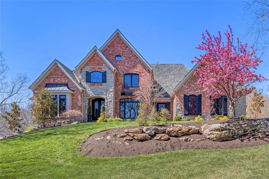 This spectacular St. Albans-built Estate home features 6848 sf of living space enhanced by oak hardwoods, soaring ceilings, extensive millwork & expansive windows with private wooded views. Dramatic 2-sty foyer leads to library-paneled study, elegant dining room & stunning great room with floor-to-ceiling stone fireplace flanked by 2-sty windows. Designer kitchen with 42” custom cabinetry, granite countertops, premium appliances, 8’ center island & butler’s pantry adjoins hearth room highlighted by brick & stone fireplace. Coffered primary bedroom suite with luxury bath with shower spa offers an appealing retreat. The 2nd floor extends the living quarters with 3 additional ensuite bedrooms. Lower Level includes recreation room with 3rd fireplace, game room & media room plus workout room, 5th bedroom & pool bath. French doors open to outdoor living area with deck, covered patio, pergola with full-height fireplace & grilling station & resort style pool surrounded by landscaped gardens. Additional Rooms: Mud Room